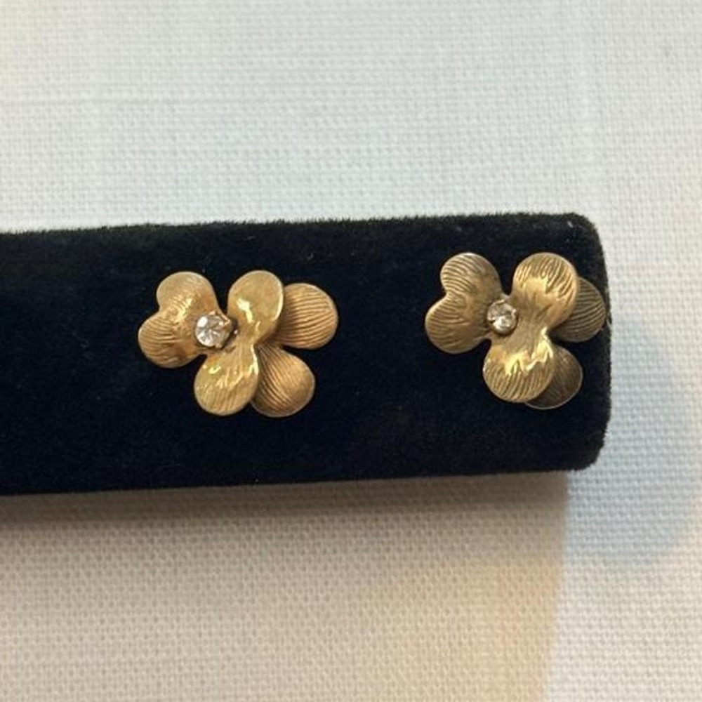 Gold two-layer textured flower stud earrings with diamond center